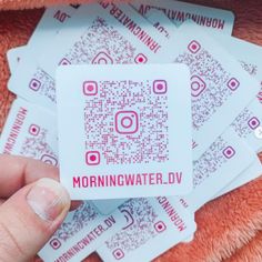 someone is holding up some stickers with the word morningwater dv on them