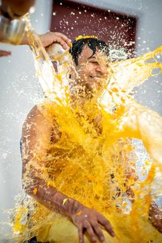 a man is splashing water on his face