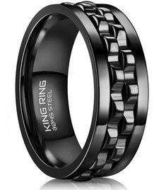 men's black ceramic ring with an intricate design in the center and beveled edges