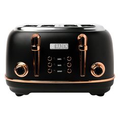 the black toaster has gold trimmings and is on display with two different knobs