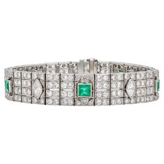 Finely crafted in platinum with 5 Square cut Emerald weighing approximately a total of 4.00 carats, 5 Marquise cut Diamonds weighing approximately a total of 2.00 carats, and 200 small Round cut diamonds weighing approximately a total of 12.00 carats. Size 7 1/8 inches Art Deco White Gold Bracelets With Brilliant Cut Diamonds, Art Deco Platinum Diamond Cut Bracelet, Art Deco Diamond Cut Platinum Bracelet, Art Deco Formal Tennis Bracelet With Brilliant Cut, Formal Art Deco Tennis Bracelet With Brilliant Cut, Formal Art Deco Brilliant Cut Tennis Bracelet, Art Deco Platinum Tennis Bracelet With Diamond Accents, Art Deco White Gold Tennis Bracelet With 17 Jewels, Art Deco White Gold Diamond Bracelet