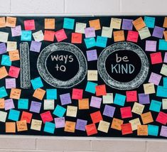 a bulletin board with post - it notes and words written on it that read 100 ways to be kind