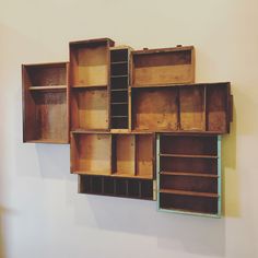 several wooden boxes are hanging on the wall