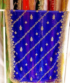 Beautiful Chiffon Dupattas with gold gota and sequins embellishment. Beautiful embroidery design all over dupatta. Gold kiran lace on all 4 sides. Stunning dupatta for the perfect addition to any outfit. Material: Fine Chiffon Colours: Variety of colours available please select options Approx size Length: 90inch Width:  44inch Please also visit our eBay store for a variety of affordable casual and formal wear outfits. Gold Embroidered Georgette Fabric With Pallu, Blue Bollywood Shawl Dupatta, Blue Bollywood Dupatta Shawl, Blue Net Dupatta For Festive Occasion, Festive Blue Net Dupatta, Blue Shawl For Wedding And Festivals, Gold Bollywood Embroidered Georgette Fabric, Blue Bollywood Shawl For Festive Occasions, Blue Bollywood Shawl For Festivals