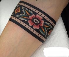 a woman's foot with a tattoo on it and a flower in the middle