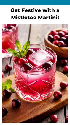 a glass filled with cranberry juice and garnished with mint