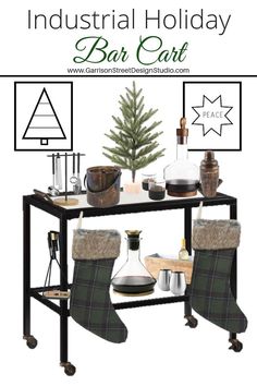 an industrial holiday bar cart with stockings and christmas decorations on the top, sitting in front of a small fir tree