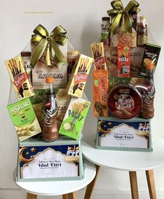 two baskets filled with snacks and condiments sitting on top of tables next to each other