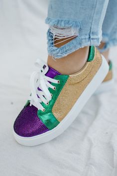 a woman's feet wearing colorful sneakers