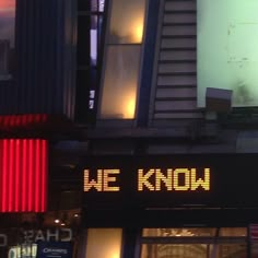 a sign that says we know on the side of a building