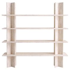 a white book shelf with four shelves on each side