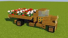 a wooden truck with flowers in the bed