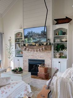 a living room filled with furniture and a flat screen tv mounted above a fire place