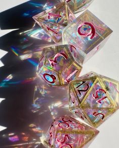 clear and red dice sitting on top of each other