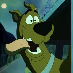 a cartoon dog with its mouth open and tongue out, standing in front of a building