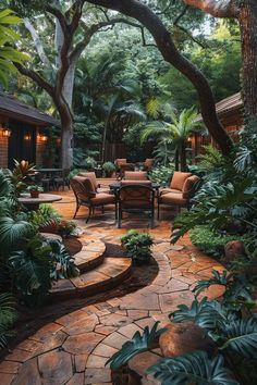 a patio with chairs and tables surrounded by trees