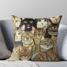 a group of cats sitting on top of a couch throw pillow with an image of many different