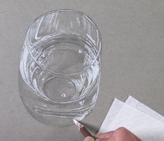 someone is drawing a glass on the table