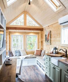 a kitchen and living room in a small cabin