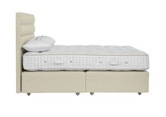 an image of a bed with mattress and headboard in white color on isolated background