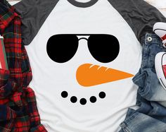 an image of a snowman with sunglasses on it's face and some clothes