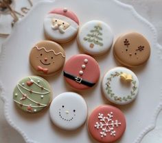 some decorated cookies on a white plate