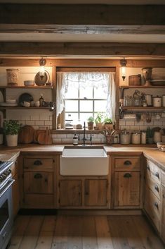 a kitchen filled with lots of wooden cabinets and counter top space next to a window