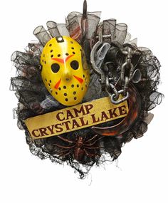 a yellow mask with chains around it and a sign that says camp crystal lake on it