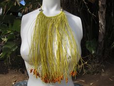 Bohemian Hippie Cotton Beaded Fringe Choker Multi Strand Bib Festival Necklace.The necklace is made of multi strands of yellow cotton, some end with beads, some without.The fall of the necklace is Approx. 18" long.Thanks for Looking!! Yellow Handwoven Bohemian Beaded Necklace, Bohemian Yellow Handwoven Beaded Necklace, Yellow Handwoven Necklace For Festival, Unique Yellow Beaded Necklaces For Festival, Unique Yellow Beaded Necklace For Festivals, Yellow Handwoven Beaded Necklaces, Yellow Wooden Beaded Necklaces For Beach, Yellow Wooden Beads Necklace For Beach, Yellow Beaded Necklace With Large Beads For Beach