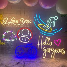 neon signs are displayed on the wall in front of balloons