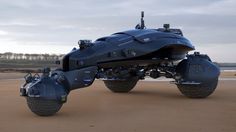 a futuristic vehicle is parked on the beach