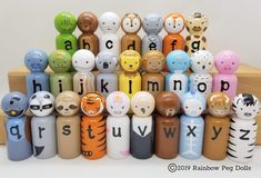 a group of small wooden toy animals sitting on top of each other