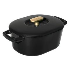 a black casserole with a gold lid