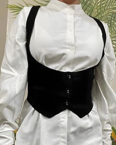 This stunning Gothic vest is perfect for the modern woman. Crafted with quality materials, this crop top features a sleek design with a button-up closure. Versatile and chic, ideal for casual wear, streetwear, or adding elegance to any outfit. Now available as a Custom-Made option. but also in sizes S, M, and L, ensuring a comfortable and flattering fit for every body type. Embrace your inner fairy with this enchanting vest, blending fairycore and cottagecore seamlessly. Incorporating historical White Button Up With Black Corset, Edgy Tank Top Outfit, Layered Corset Top Outfit, Corset Vest Women, Button Up With Corset Outfit, Corset Office Outfit, Underbust Vest, Outfits With Corsets Tops, Steampunk Vest Women