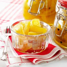 two jars filled with liquid and lemon slices