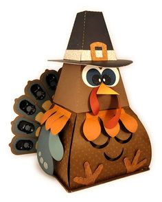 a paper bag with a turkey wearing a pilgrim hat