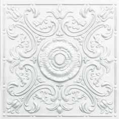 a white ceiling tile with an intricate design on the center and bottom part of it