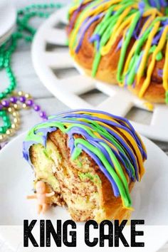 a close up of a cake on a plate with the words king cake in front of it