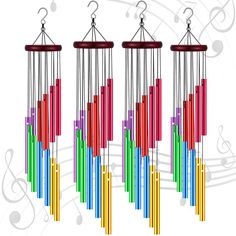 three wind chimes with musical notes in the background