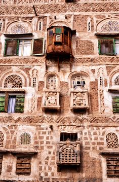 an old building with many windows and balconies