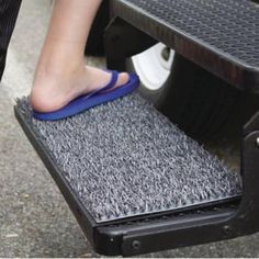 a person is cleaning the floor with a scrubber and sponge on top of it