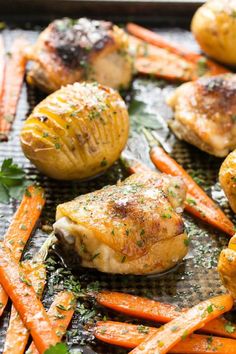 chicken and carrots on a grill with parmesan cheese in the back ground