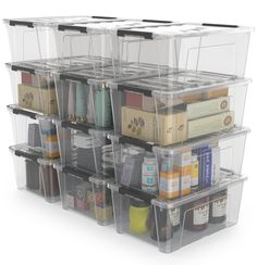 several clear storage bins stacked on top of each other with different types of items in them