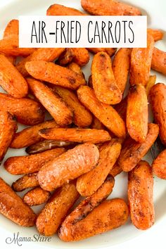 air fried carrots on a white plate with the words, air fried carrots