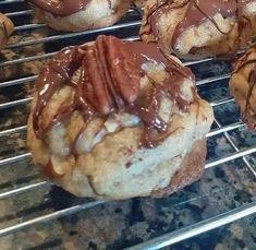 several chocolate covered cookies cooling on a rack