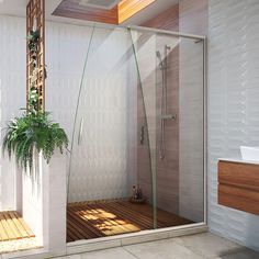 a bathroom with a shower, toilet and sink in the corner next to a potted plant