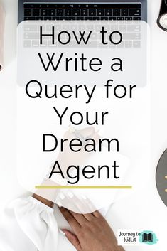 a person's hand on top of a desk with the words how to write a query for your dream agent