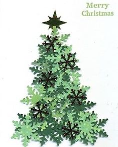 a christmas tree made out of paper with snowflakes and stars on the top