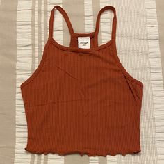 Never Worn, Burnt Orange Cropped Stretchy Tank Top. Fits Snugly And Is Perfect For The Fall! Burnt Orange Tank Top Outfit, Orange Stretch Crop Top, Stretch Orange Cropped Top, Fitted Cropped Orange Top, Fitted Orange Cropped Top, Trendy Orange Crop Top For Fall, Casual Orange Crop Top For Fall, Orange Stretch Tank Top For Spring, Trendy Stretch Orange Crop Top