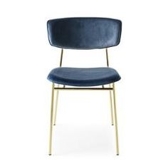 a blue chair sitting on top of a white floor next to a wooden frame and metal legs